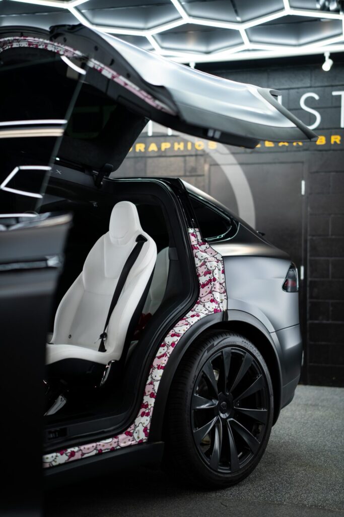 Interior custom vinyl wrap with Hello Kitty design for Colorado football star Travis Hunter