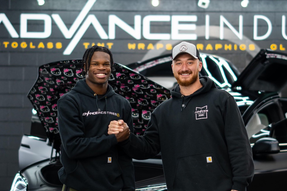 Heisman Trophy winner from Colorado Travis Hunter with Advance Industries Owner Cameron Saheb